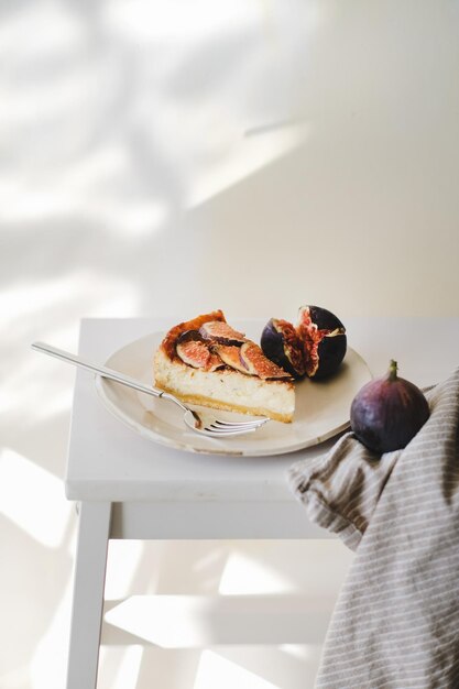 Slice of homemade gluten free fig cheesecake with fresh figs