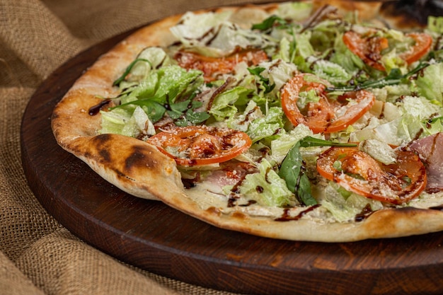 A slice of Hot Pizza on the wooden table