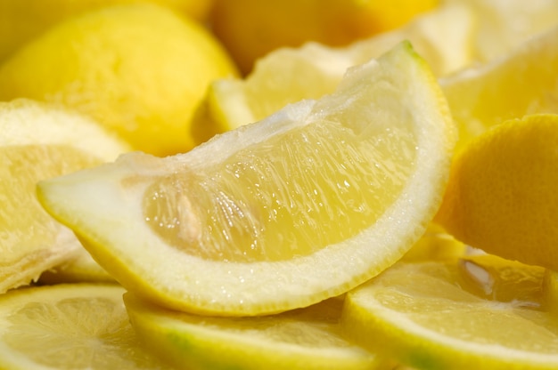 A slice of lemon with lemon background