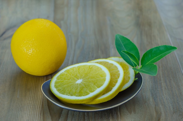 Slice orange on dish 