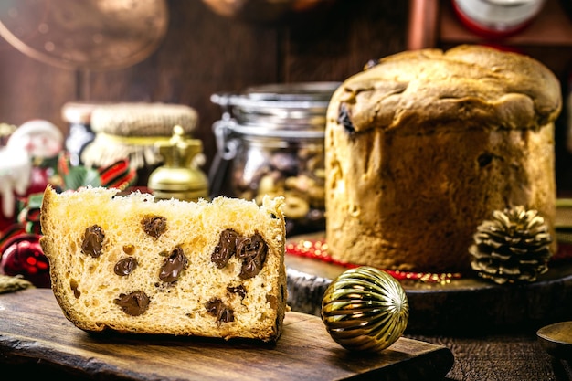 Slice of panettone, homemade bread baked with truffled chocolate chips, traditional for Christmas in Brazil and Italy.