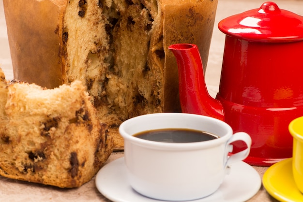 Slice of panettone with a cup of coffee