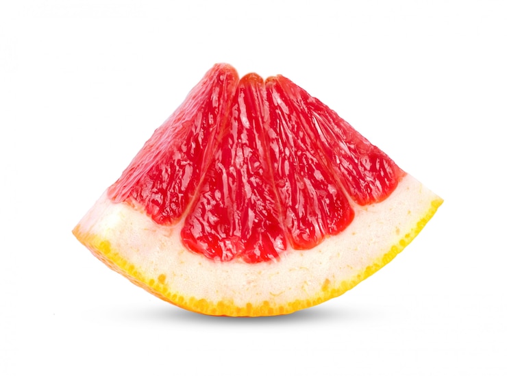 Photo slice of pink grapefruit on white table.