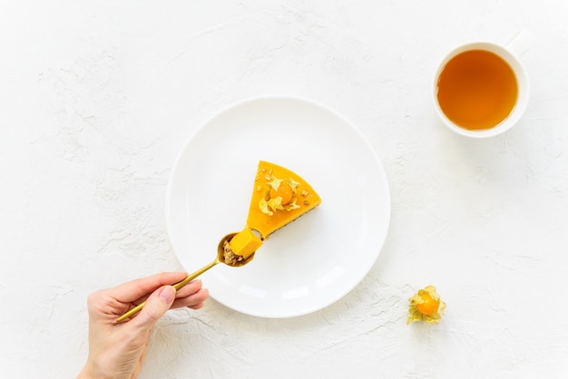 Slice of pumpkin cake on a white plate