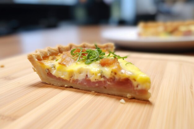 Slice of quiche lorraine with melted cheese on top