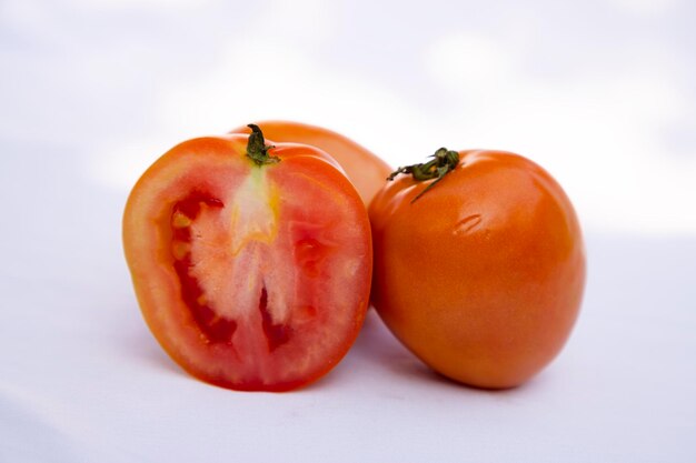 Slice Ripe Red Tomato on white Background