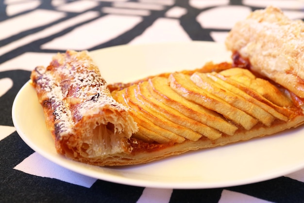 A Slice of Tasty Apple Tart on White Plate