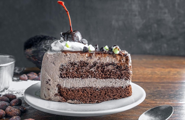 Slice of tasty homemade chocolate cake and starch as ingredients for cooking chocolate cakes