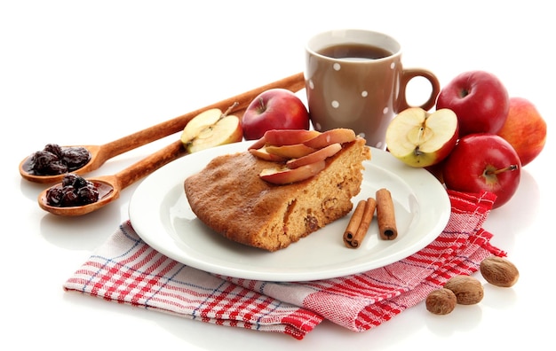 Slice of tasty homemade pie with apples and cup of coffee isplated on white