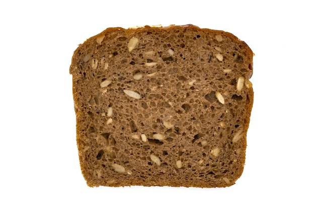 Slice of wholemeal dark bread isolated on a white background in closeup high details