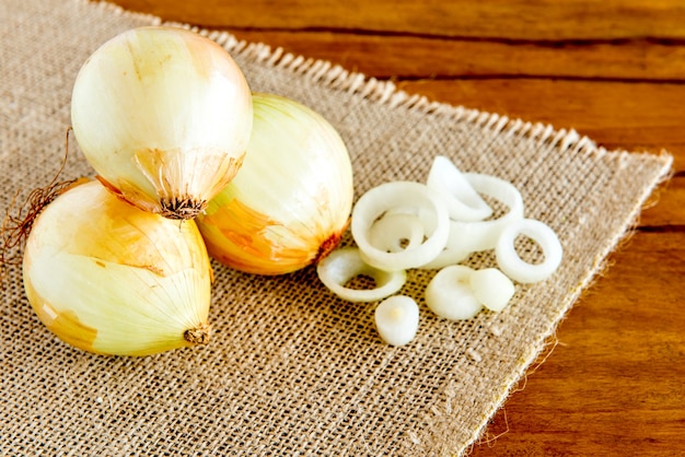 Sliced ââonions on a wooden table.