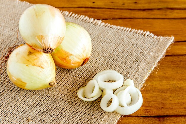 Sliced ââonions on a wooden table.