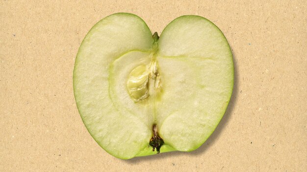 Sliced apple fruit over paper