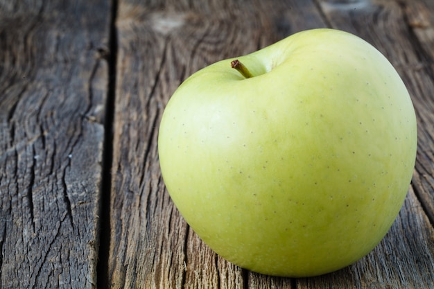 Sliced apple on rustic wooden table, close up view