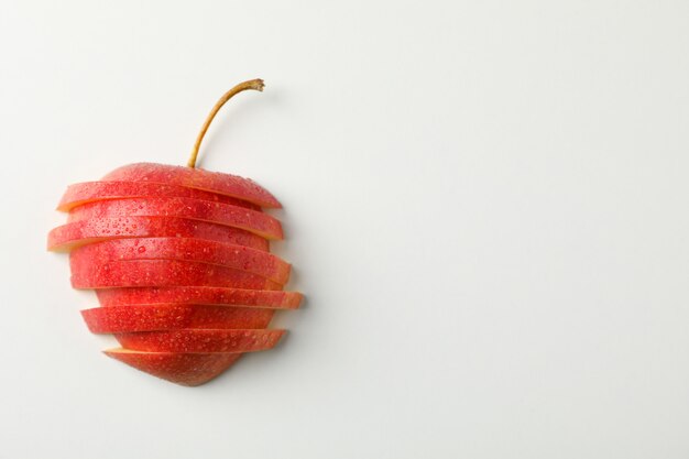 Sliced apple on white table