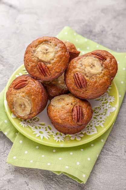 Sliced banana bread with a pecan nuts