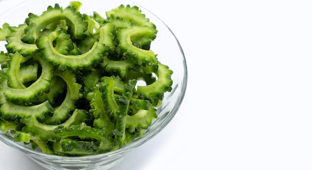 Sliced bitter gourd on white background