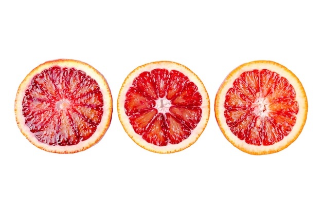 Photo sliced bloody oranges isolated on white background, fresh ripe red sicilian orange, citrus fruit.