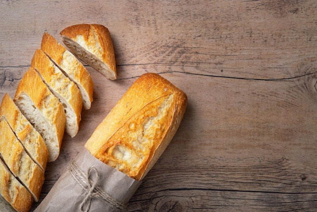 Sliced bread on a brown table Top view with copy space