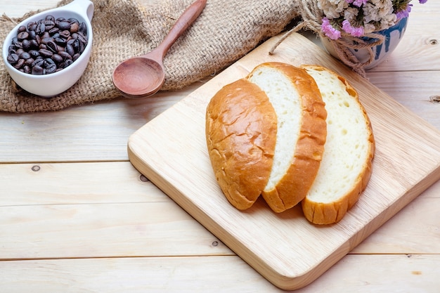 Sliced bread on wooden background