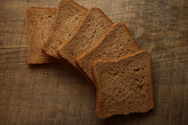 Sliced bread on a wooden background