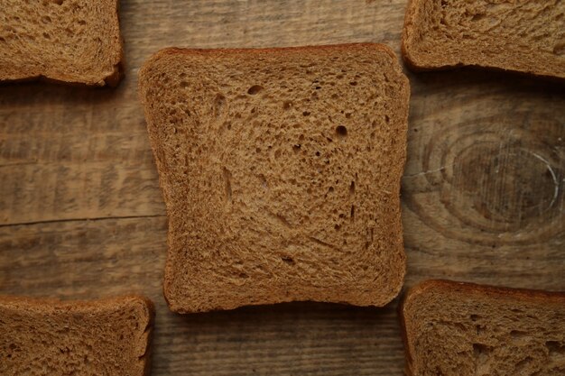 Sliced bread on a wooden background