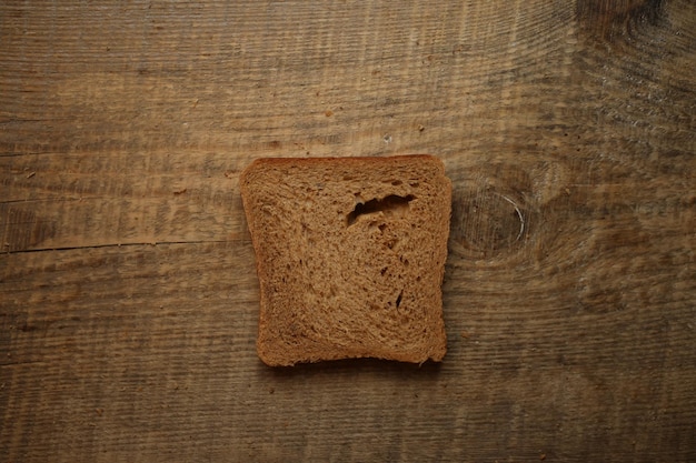 Sliced bread on a wooden background