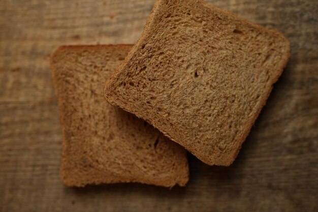 Sliced bread on a wooden background