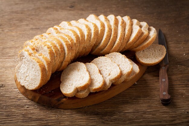 Sliced bread on a wooden cutting board