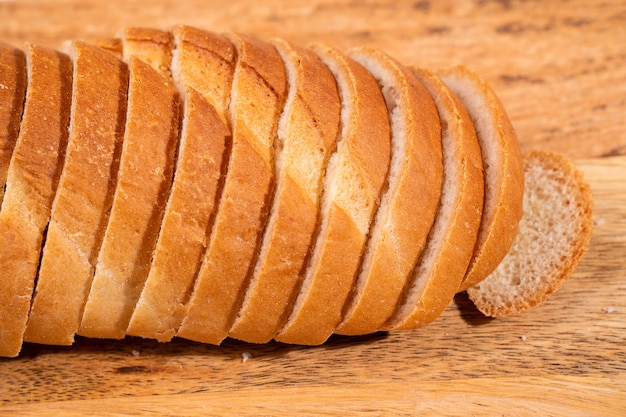 Sliced bread on a wooden cutting board