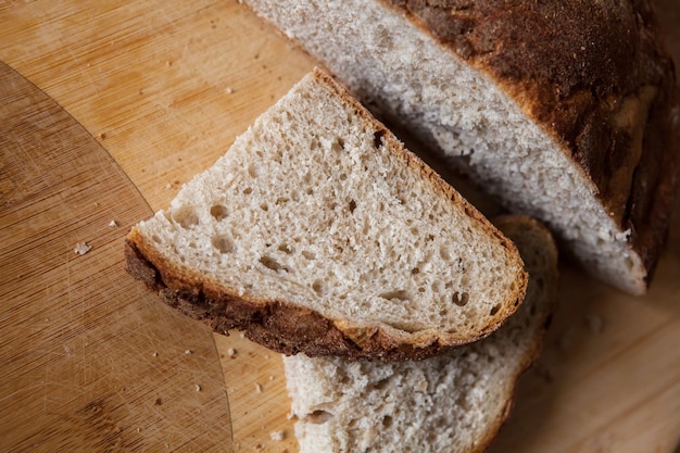 Sliced bread on wooden table