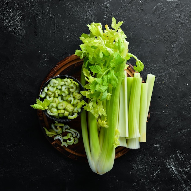 Sliced celery stalk On a black background Healthy food Top view Free space for your text