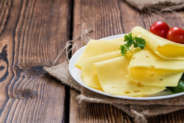 Sliced Cheese on wooden background