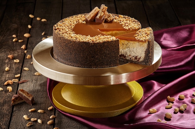 Sliced cheesecake with chocolate nuts and salted caramel