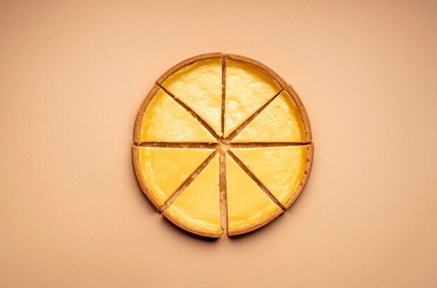 Sliced cheesecake on a yellow background Equal sliced cake