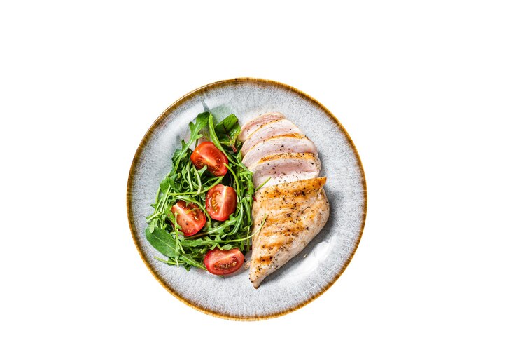 Photo sliced chicken breast fillet steak with green salad in a plate high quality isolate white background