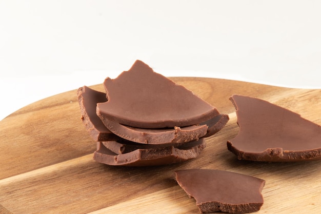 Sliced chocolate on cutting board