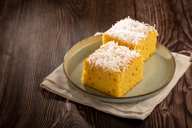 Sliced coconut cake on the table