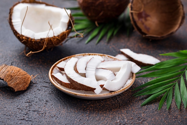 Sliced coconut and palm leaves