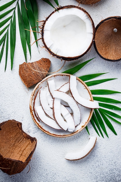 Sliced coconut and palm leaves