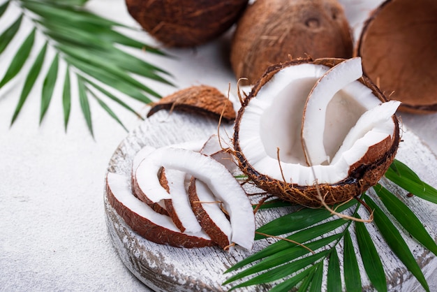 Sliced coconut and palm leaves