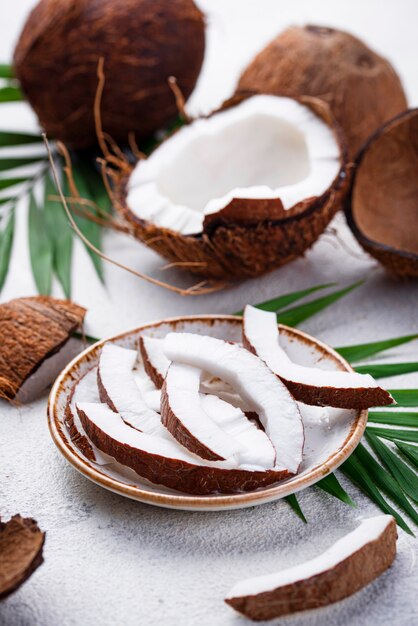 Sliced coconut and palm leaves