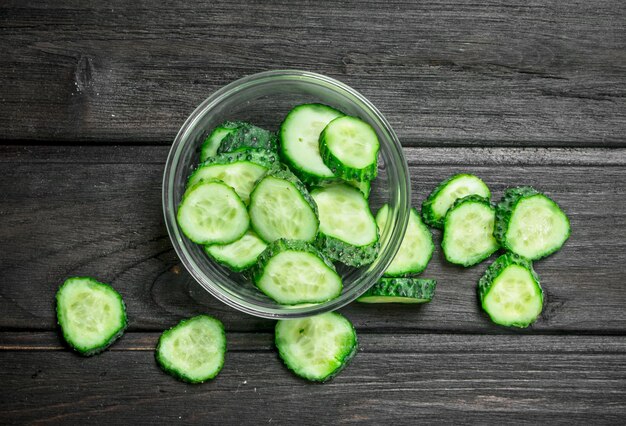 Sliced cucumbers in a glass bowl