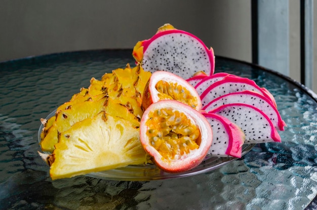 Sliced delicious juicy ripe tropical fruits closeup