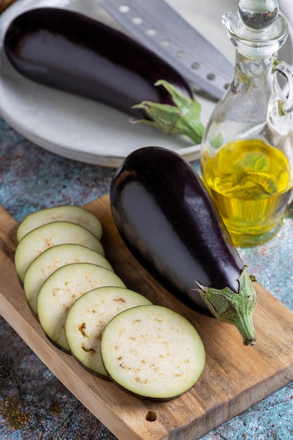 Sliced eggplant on the cutting board on the table