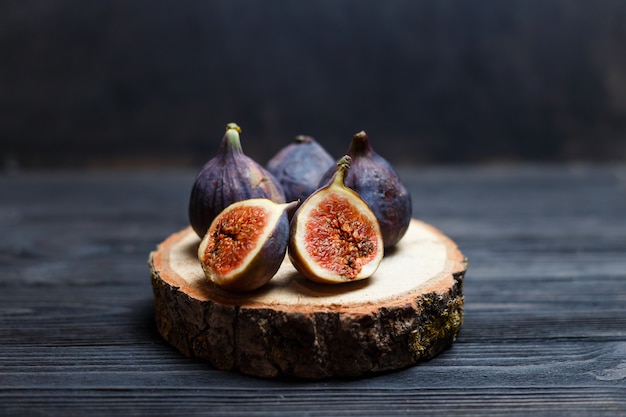 Sliced fig fruits on a wooden board