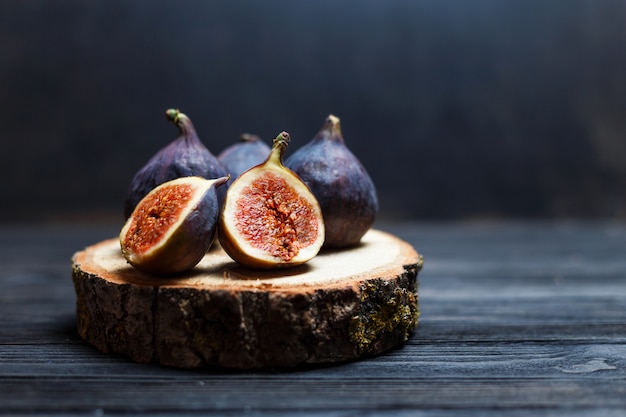 Sliced fig fruits on a wooden board