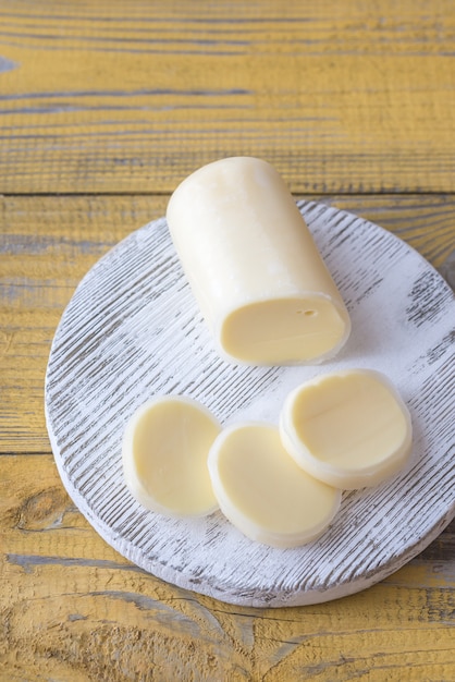 Sliced Formaggio on the wooden board