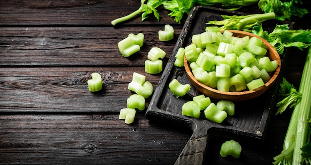 Sliced fresh celery On a dark wooden background