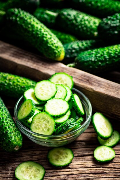 Sliced fresh cucumbers in a glass bowl